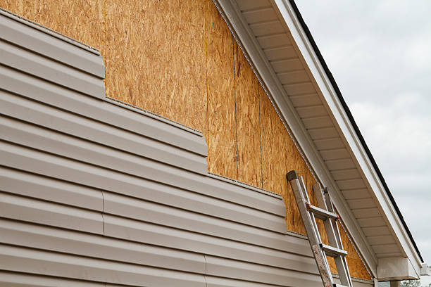 Professional Vinyl Siding technician working in Winthrop, MA